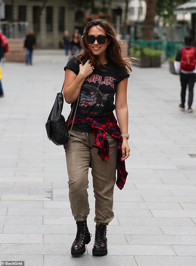 Myleene Klass shows off her style in combat trousers and chunky black