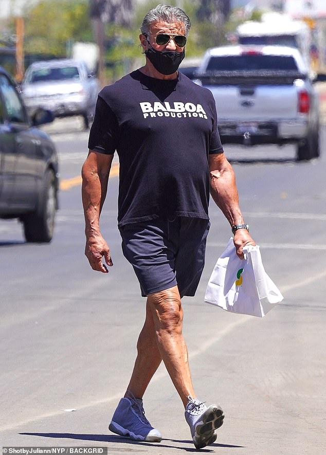 Sylvester Stallone, 74, puts on buff display as he grabs ...